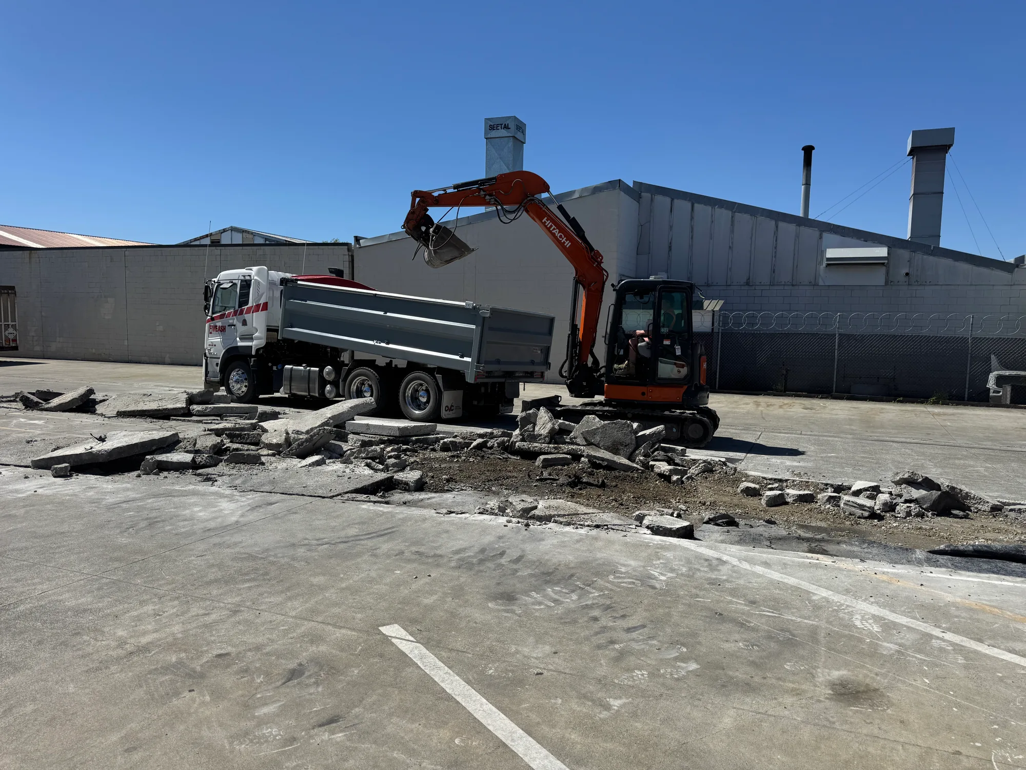 Yellow excavator positioned on Canterbury residential section