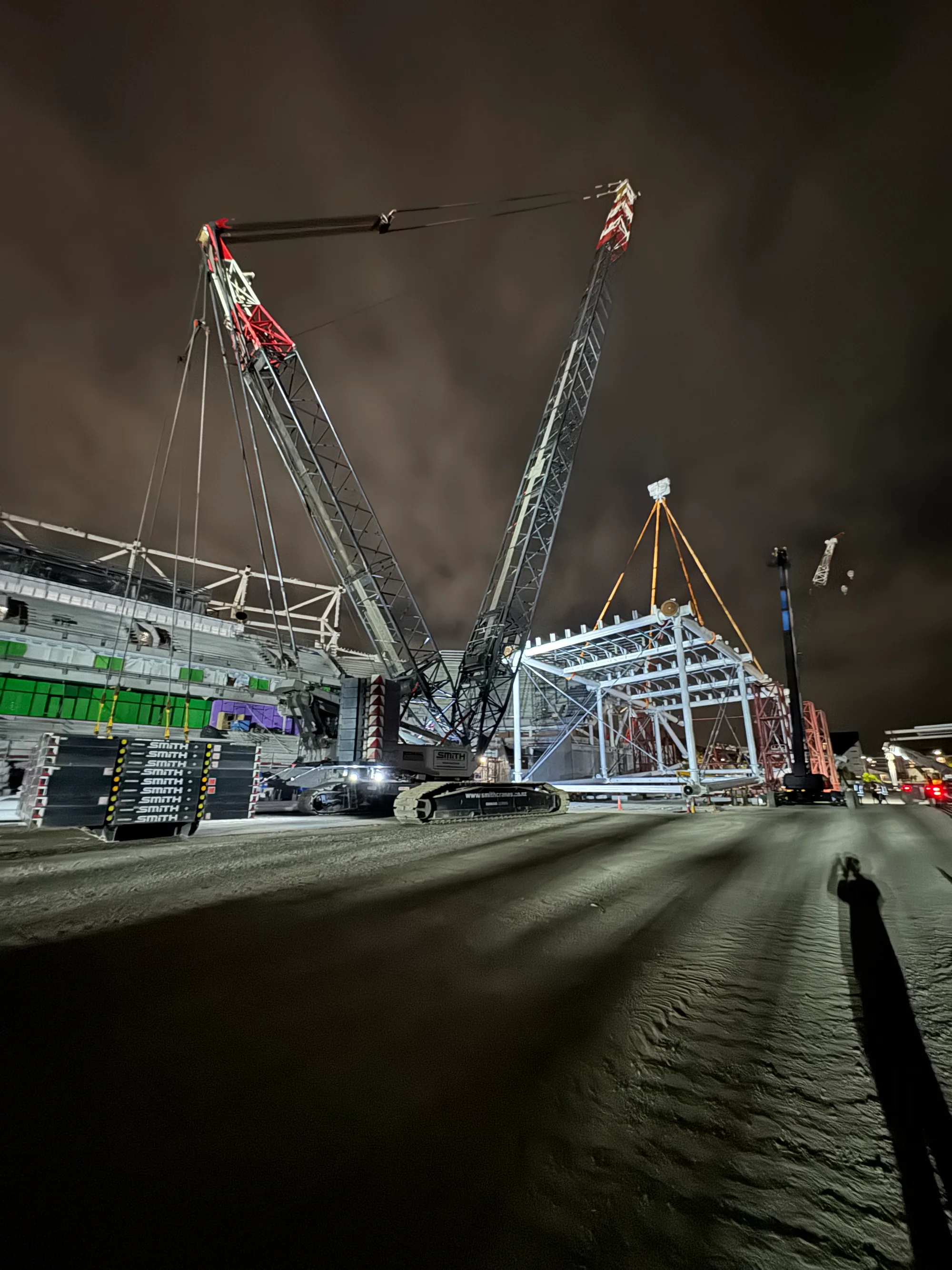 Crawler crane operating at major Canterbury civil infrastructure project, night shift